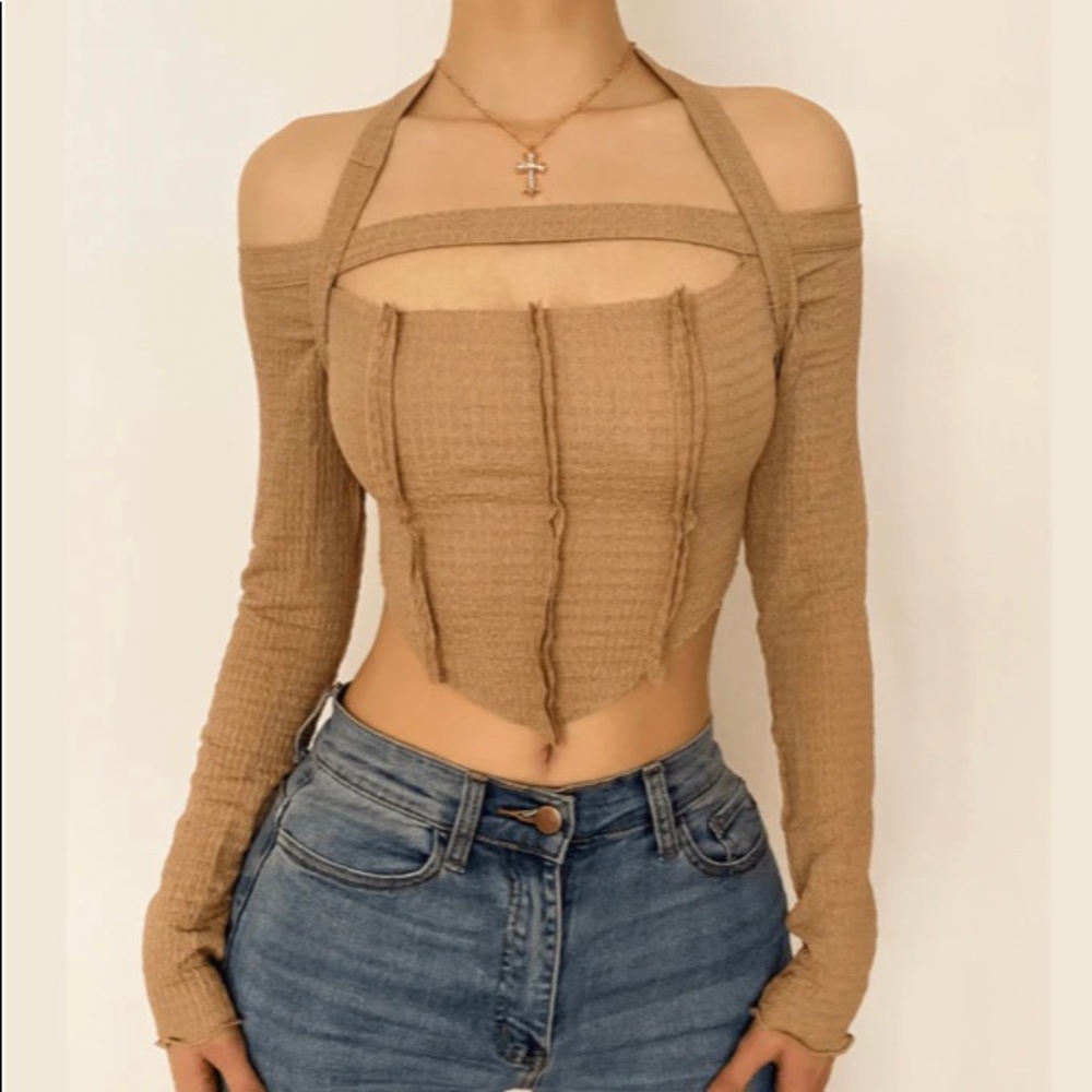It’s a light tan long sleeve shirt from Halibuy